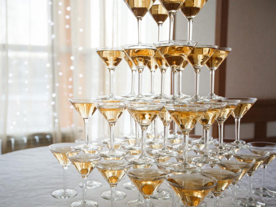 a champagne tower in martini glasses