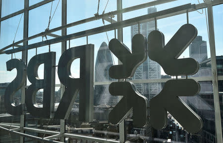 FILE PHOTO: The City of London business district is seen through windows of the Royal Bank of Scotland (RBS) headquarters in London, Britain September 10, 2015. REUTERS/Toby Melville/File Photo