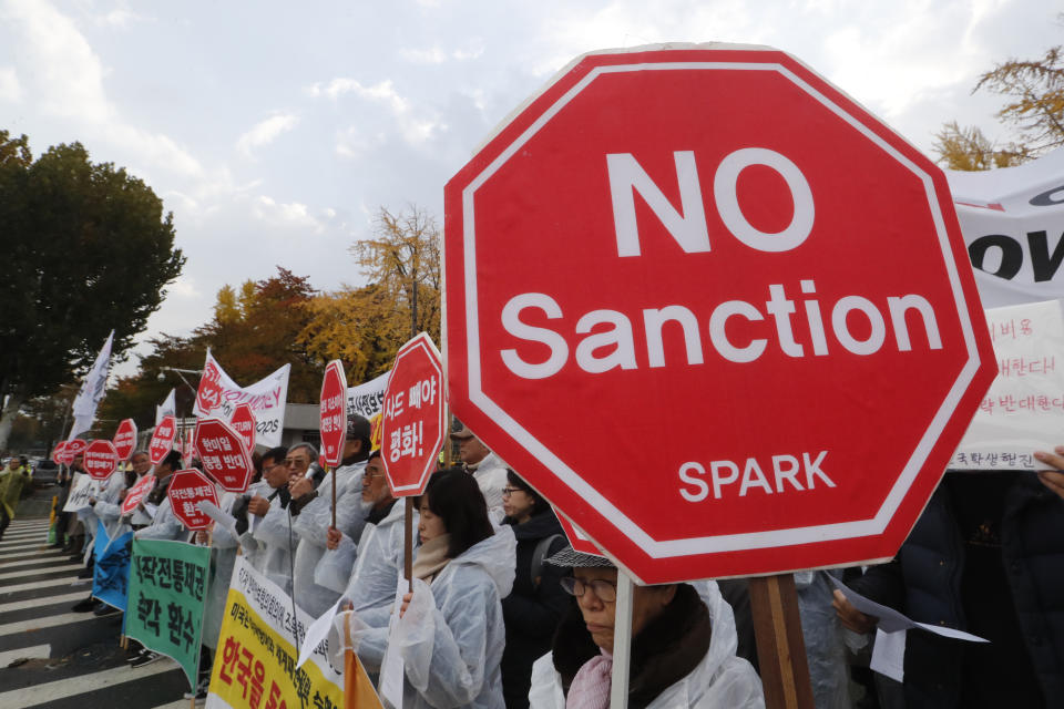 Protesters stage a rally to oppose a visit by U.S. Secretary for Defense Mark Esper in front of the Defense Ministry in Seoul, South Korea, Friday, Nov. 15, 2019. (AP Photo/Ahn Young-joon)