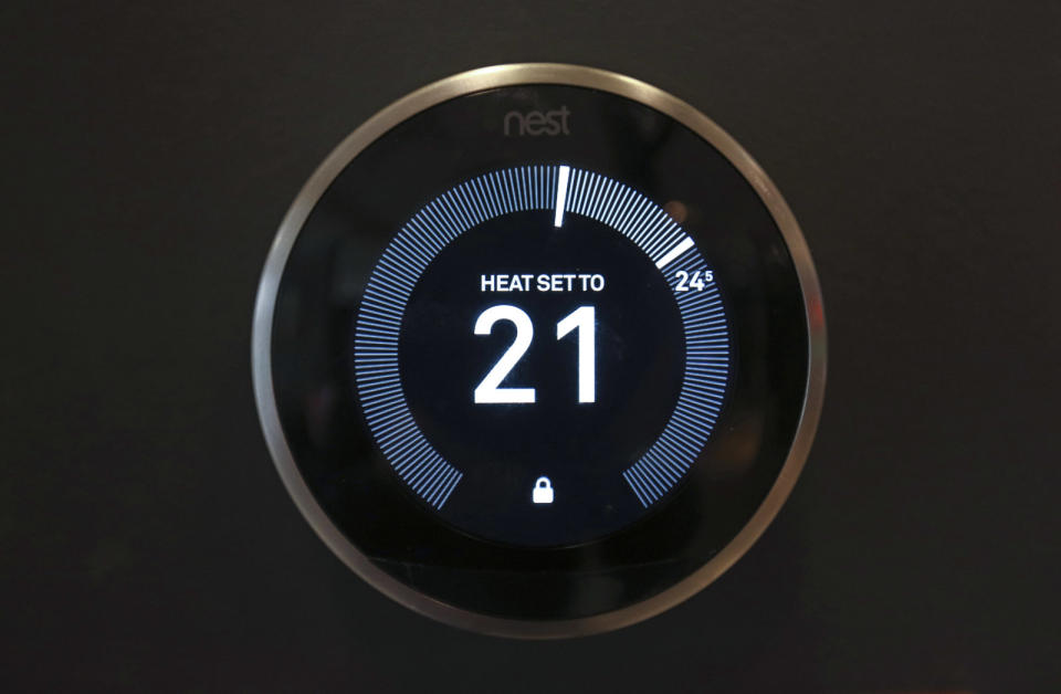 A Nest Labs Inc. digital wireless controlled thermostat sits on display in the Smart Home section of a John Lewis Plc department store in London, U.K., on Friday, April 8, 2016. The increasing integration of connected devices into our lives, what is commonly referred to as the Internet of things or IoT, promises enormous benefits for consumers and businesses. Photographer: Chris Ratcliffe/Bloomberg via Getty Images