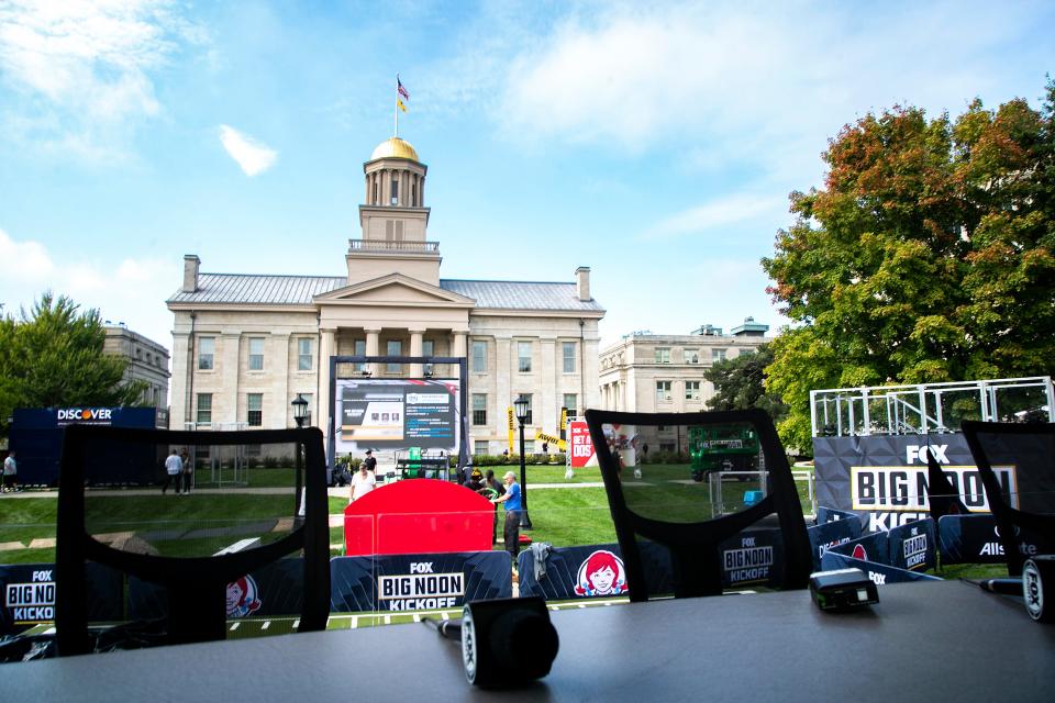 The Old Capitol Building is seen as setup continues for the Fox Sports NCAA football Big Noon Kickoff pregame show, Friday, Oct. 8, 2021, on the east side of the Pentacrest on the University of Iowa campus in Iowa City, Iowa. No. 3 Iowa Hawkeyes host No. 4 Penn State on Saturday in Iowa City. The Big Noon Kickoff show starts welcoming fans to its set starting at 8 a.m.
