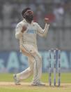 New Zealand's Ajaz Patel celebrates the dismissal of India's Mohammed Siraj during the day two of their second test cricket match with India in Mumbai, India, Saturday, Dec. 4, 2021.(AP Photo/Rafiq Maqbool)