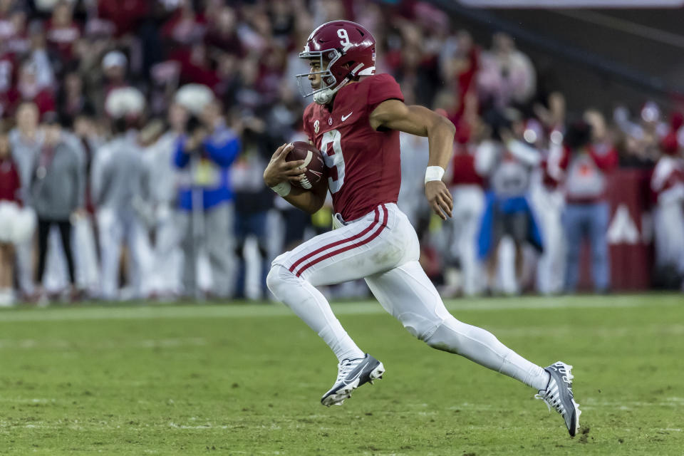 Alabama quarterback Bryce Young (9) runs the ball for a long gain during the first half of an NCAA college football game against Auburn, Saturday, Nov. 26, 2022, in Tuscaloosa, Ala. (AP Photo/Vasha Hunt)