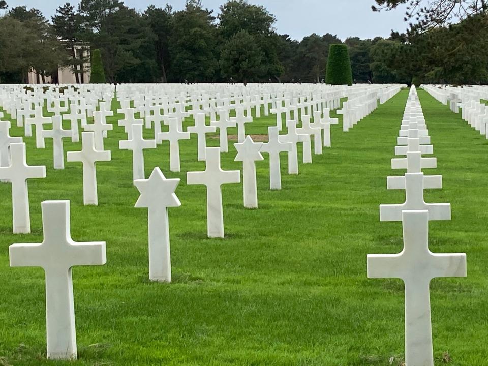 White crosses, Stars of David, American Cemetery above Omaha Beach where thousands of people died during WWII.