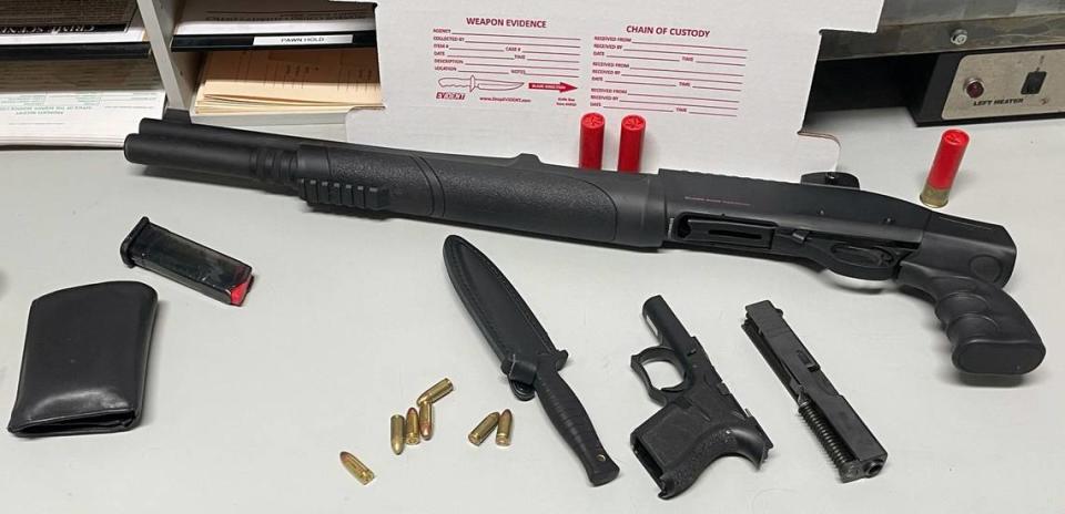 A shotgun, handgun, knife, magazine and bullets are displayed on a Monroe County Sheriff’s Office table following an arrest Thursday, Oct. 26, 2023.