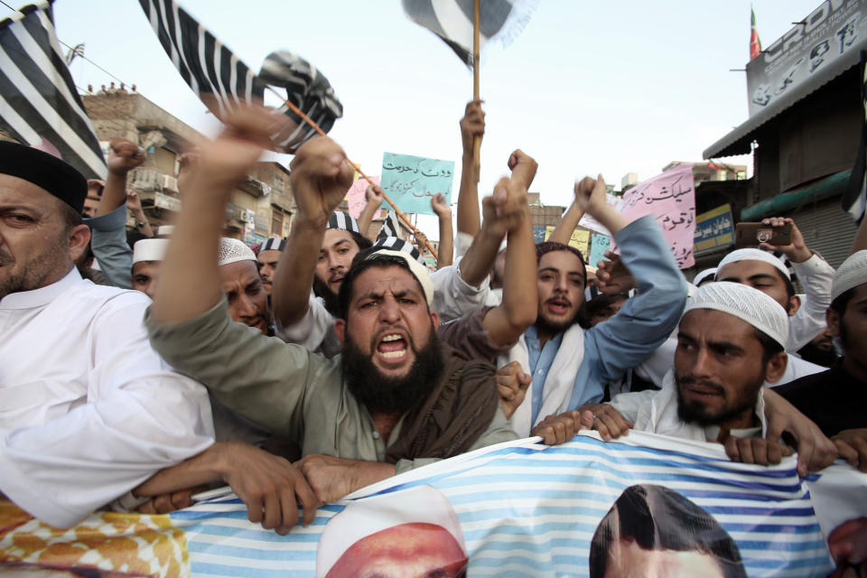 Supporters of different political parties demonstrate to reject the election results in Peshawar, Pakistan, Friday, July 27, 2018. With Pakistani election officials declaring the party of Imran Khan to be the winner of parliamentary balloting, the former cricket star turned Friday to forming a coalition government, since the party did not get an outright majority.(AP Photo/Muhammad Sajjad)