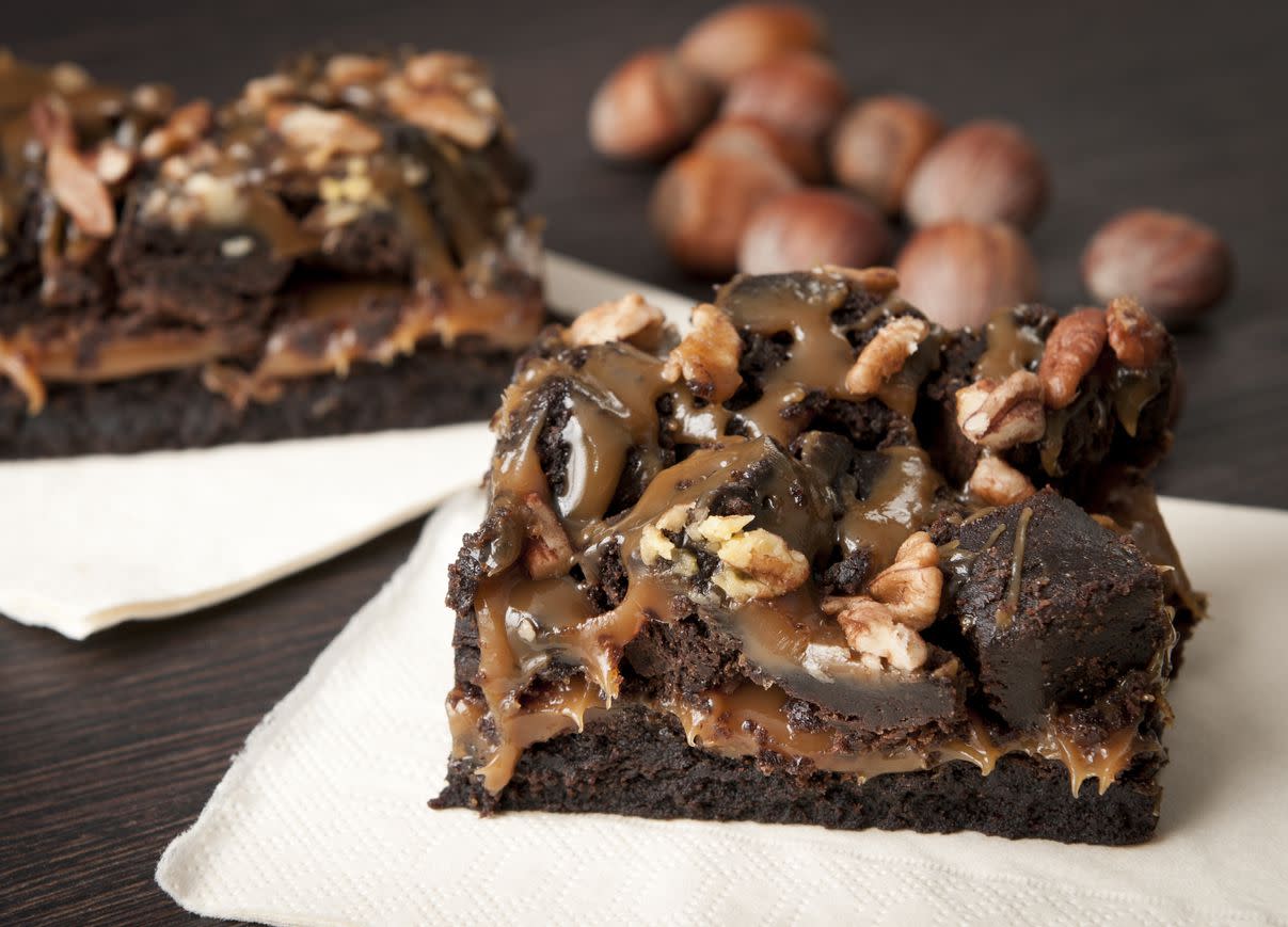 Brownie chocolate cake with nuts and caramel sauce