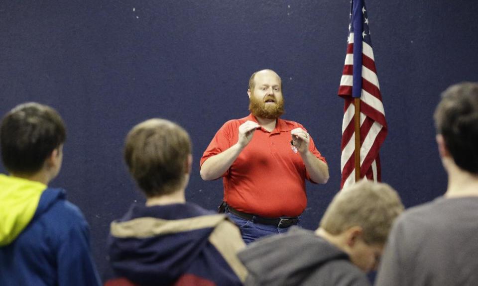 In this Tuesday, Feb. 4, 2014 photo, Trail master Phillip Buchholz speaks to boys during Trail Life meeting in North Richland Hills, Texas. Trail Life USA, the new Christian-based alternative to the Boy Scouts of America, excludes openly gay members. (AP Photo/LM Otero)