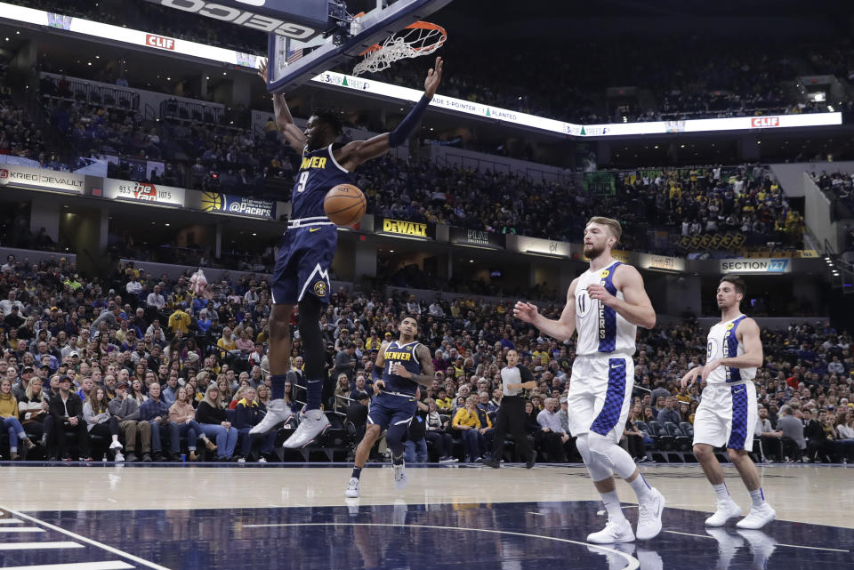 Denver Nuggets' Jerami Grant (9) dunks during the first half of the team's NBA basketball game against the Indiana Pacers, Thursday, Jan. 2, 2020, in Indianapolis. (AP Photo/Darron Cummings)