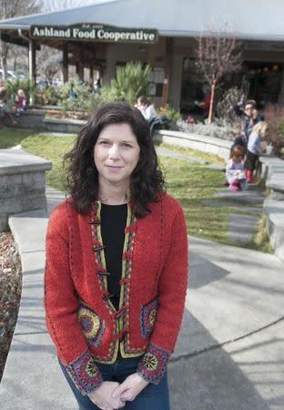 Becky Sherman, project coordinator for the Ashland immunization team, stands in the courtyard of the Ashland Food Cooperative in Ashland, Oregon February 4, 2015. REUTERS/Amanda Loman