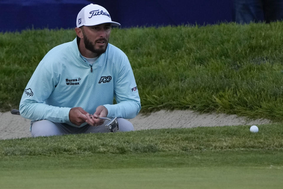 Max Homa prepares to putt on the 18th hole of the South Course at Torrey Pines during the final round of the Farmers Insurance Open golf tournament, Saturday, Jan. 28, 2023, in San Diego. (AP Photo/Gregory Bull)