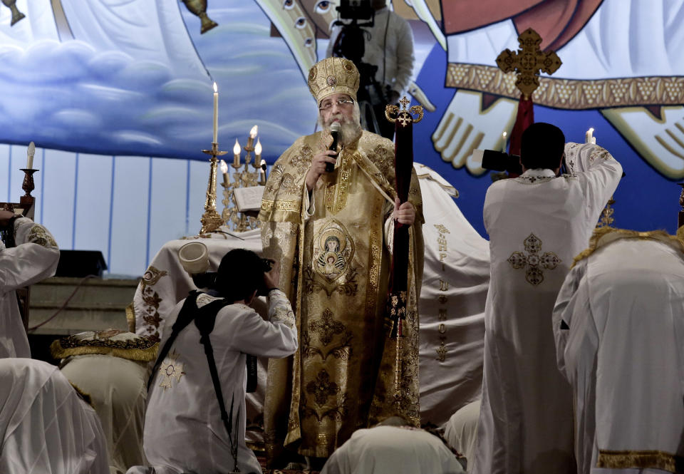 Egyptian Coptic Pope Tawadros II leads prayer during the Easter Eve service at St. Mark's Cathedral in Cairo, Egypt, Saturday, April 15, 2017. In February, a series of murders and killings claimed by IS in northern Sinai led hundreds of families to evacuate the area, fleeing west. The most recent major attack came on Palm Sunday. (AP Photo/Nariman El-Mofty)