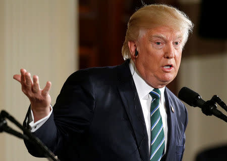 U.S. President Donald Trump speaks during a joint news conference with German Chancellor Angela Merkel in the East Room of the White House in Washington, U.S., March 17, 2017. REUTERS/Joshua Roberts