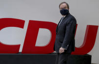 Armin Laschet, chairman of the German Christian Democratic Union, CDU, arrives for a press conference at the party's headquarters in Berlin, Germany, Monday, Jan. 25, 2021. (AP Photo/Michael Sohn, pool)