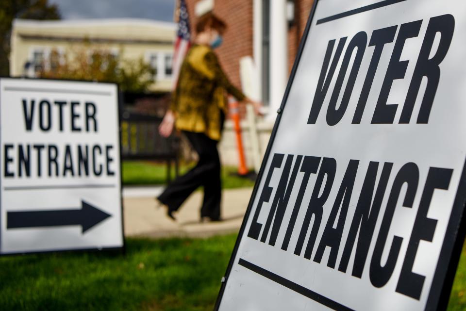 A poll worker enters the senior center in Hasbrouck Heights, which serves as a polling location in the 2020 election on Tuesday November 3, 2020. 