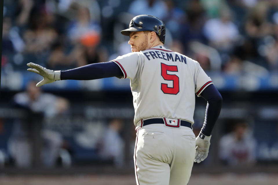 Atlanta Braves' Freddie Freeman waves toward the New York Mets' dugout after he was replaced by a pinch runner after he hit a single during the third inning of a baseball game, Sunday, Sept. 29, 2019, in New York. (AP Photo/Kathy Willens)