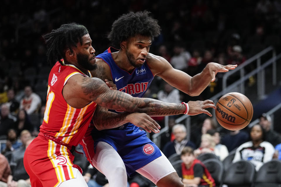 Atlanta Hawks forward Saddiq Bey (41) knocks the ball away from Detroit Pistons forward Marvin Bagley III (35) during the first half of an NBA basketball game Monday, Dec. 18, 2023, in Atlanta. (AP Photo/John Bazemore)