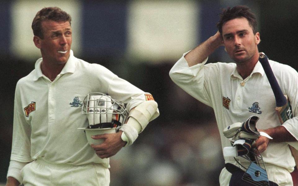 Alec Stewart (left) looks across to his England team-mate Graham Thorpe (right) as they come off the field after a 150-run partnership on the fourth day of the second Test in Zimbabwe in 1996