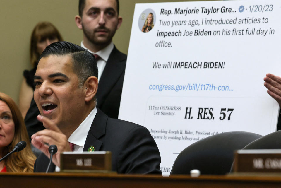Congressman Robert Garcia (D-CA) asks a question in front of a tweet by committee member Rep. Marjorie Taylor Greene (R-GA) calling for President Biden's impeachment during a House Oversight and Accountability Committee impeachment inquiry hearing into U.S. President Joe Biden on Sept. 28, 2023, in Washington, D.C. / Credit: JIM BOURG / REUTERS