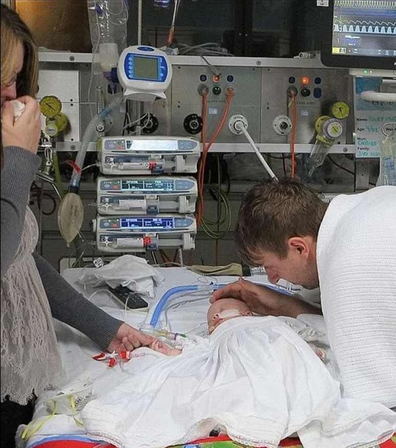 Catherine and her husband said goodbye to their son as he lay dying on the hospital bed. Photo: Facebook