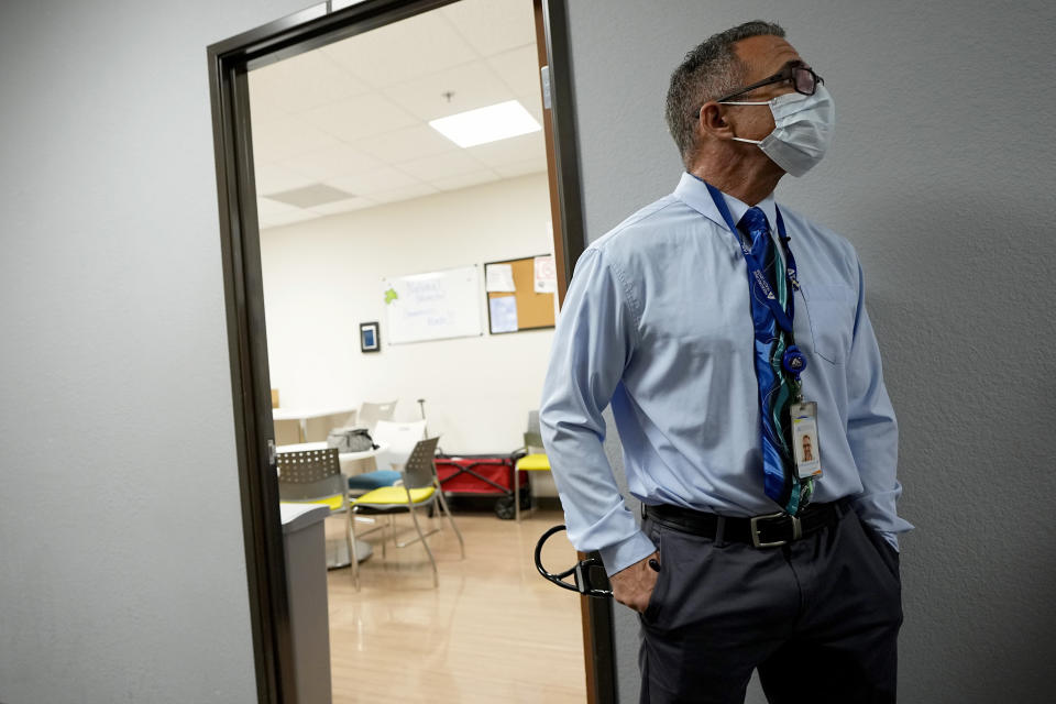 Nurse practitioner Anthony Carano waits to meet with a patient at the Mountain Park Health Center, Thursday, March 30, 2023, in Phoenix. As heat waves fueled by climate change arrive earlier, grow more intense and last longer, people over 60 who are more vulnerable to high temperatures are increasingly at risk of dying from heat-related causes. Heat related deaths are challenging community health systems, utility companies, apartment managers and local governments to better protect older people when temperatures soar.(AP Photo/Matt York)