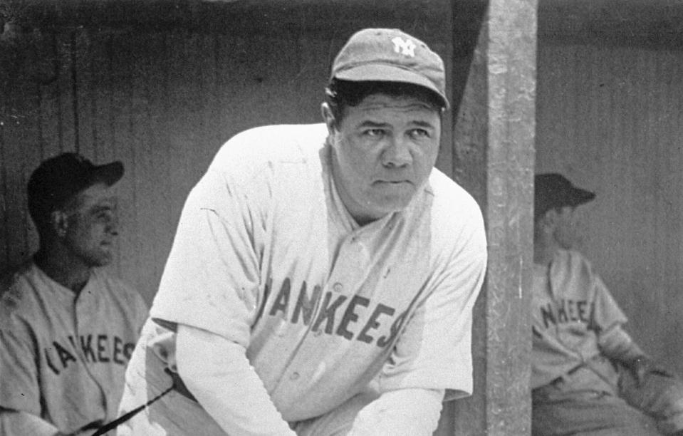 FILE - In this July 1929 file photo, New York Yankees' Babe Ruth, who was injured, stands in the dugout during the baseball team's game at Cleveland. A Babe Ruth road jersey dating to 1928-30 has sold at auction for $5.6 million. Hunt Auctions, which handled Saturday's sale, says the price breaks a record for the most expensive piece of sports memorabilia ever sold. A Ruth jersey from 1920 previously sold for $4.4 million. (AP Photo, File)