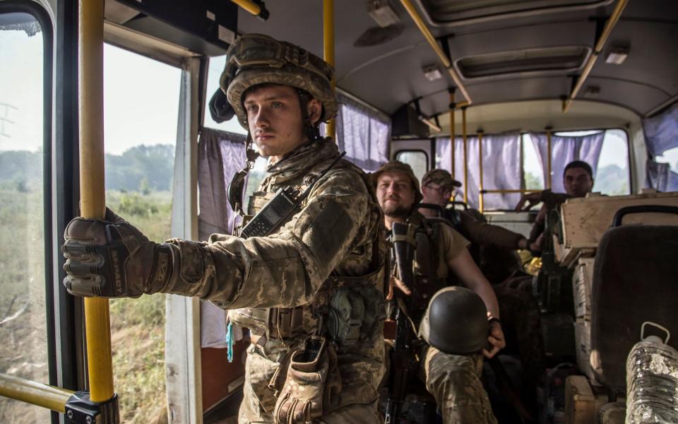 Ukrainian servicemen ride a bus to their positions near the city of Severodonetsk - OLEKSANDR RATUSHNIAK/EPA-EFE/Shutterstock