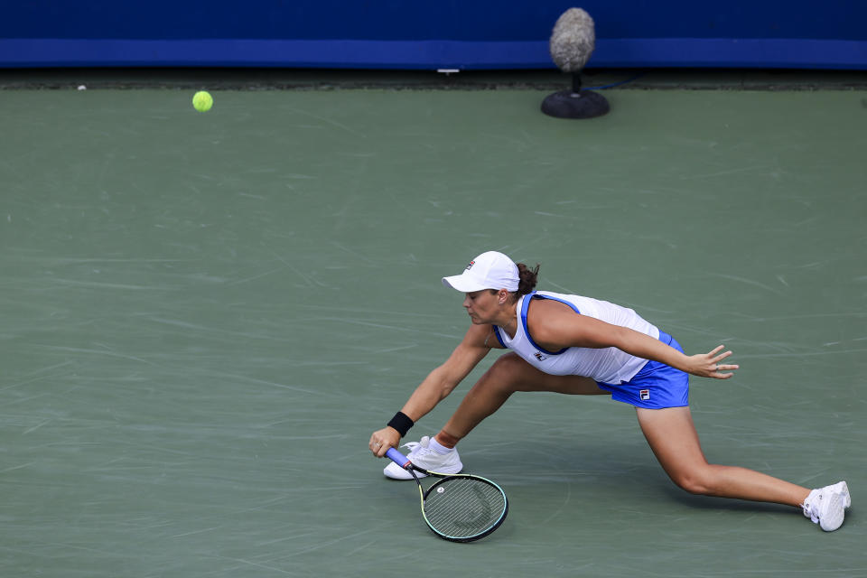 Ashleigh Barty, of Australia, reaches but is unable to return to Jil Teichmann, of Switzerland, during the women's single final of the Western & Southern Open tennis tournament Sunday, Aug. 22, 2021, in Mason, Ohio. (AP Photo/Aaron Doster)