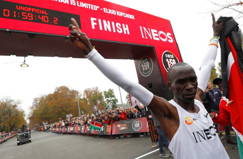 Kenya's Eliud Kipchoge, the marathon world record holder, celebrates after crossing the finish line during his attempt to run a marathon in under two hours in Vienna, Austria, October 12, 2019. REUTERS/Leonhard Foeger