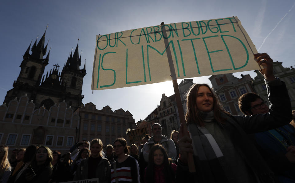 A girl holds a sign during a protest at the Old Town Square in Prague, Czech Republic, Friday, Sept. 20, 2019. Several hundreds of protestors gathered in response to a day of worldwide demonstrations calling for action to guard against climate change. (AP Photo/Petr David Josek)