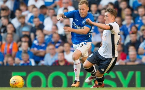 Scott Arfield (left) goes past Bury's Callum Styles - Credit: pa