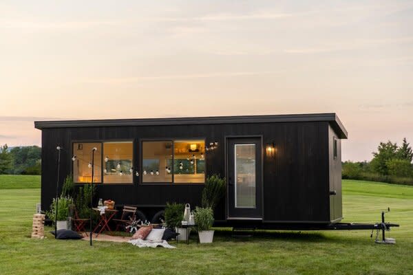 Set on a custom ESCAPE trailer that can be easily hooked up to a vehicle, the IKEA tiny home is clad in shou sugi ban–type exterior siding and fitted with low-E thermopane windows.