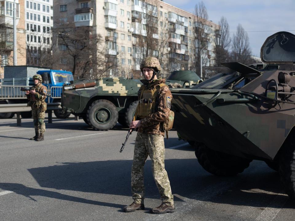 Soldiers guard Kyiv in Ukraine during Russia's invasion on February 25, 2022.