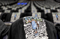 T-shirts in honor of Minnesota Lynx's Sylvia Fowles are draped on the seats before the team's WNBA basketball game against the Seattle Storm on Friday, Aug. 12, 2022, in Minneapolis. (Elizabeth Flores/Star Tribune via AP)