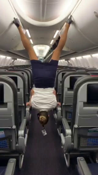 This flight attendant shows off her remarkable acrobatic skills to close the overhead bins with her feet - while wearing high heels. Lindsey O'Brien, 35, gripped onto the armrests before flipping upside down and using her feet to close four luggage containers above. She twirled back down to the aisle and lifted her arms in triumph as her fellow crew members cheered her on. The video was filmed in June aboard an aircraft which had been grounded in her home city of Philadelphia, Pennsylvania, due to Covid-19.