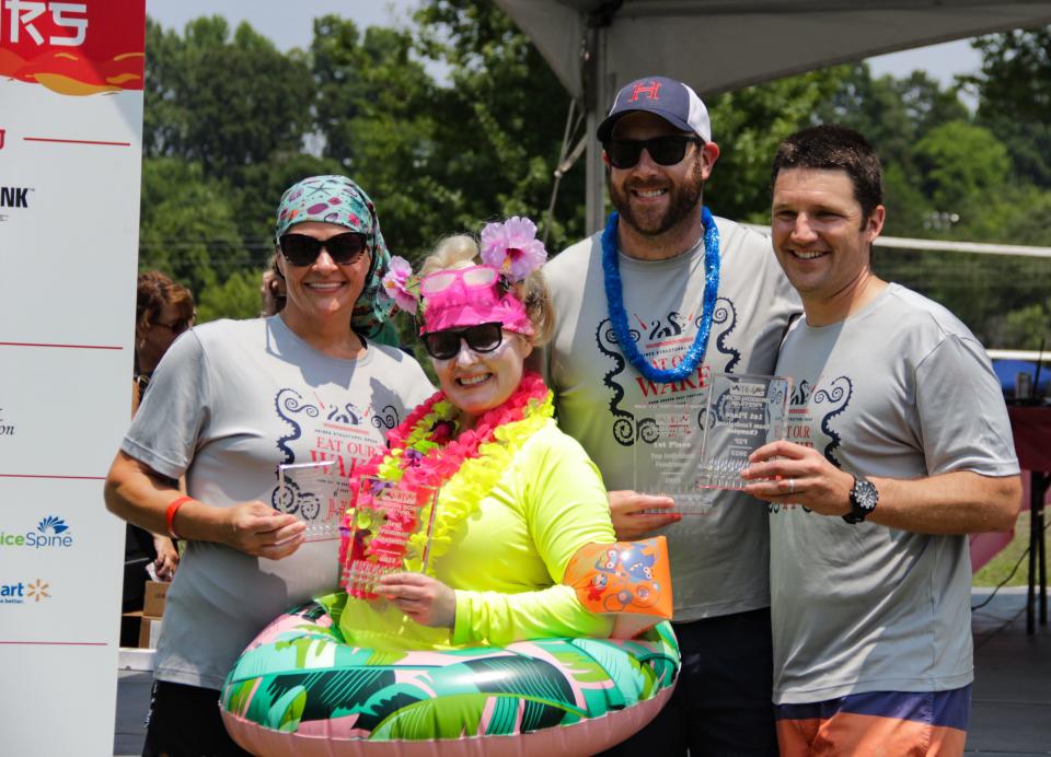 The Haines Structural Group crew, Eat Our Wake, was the winning team at the annual KARM Dragon Boat Festival held at the Cove at Concord Park on June 17, 2023. From left: Christy Tipton, Danielle Hughes, Todd Whelan and Bobby Haines.