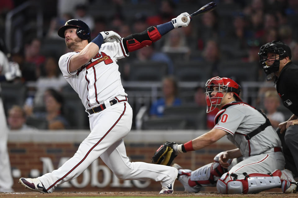 Atlanta Braves' Josh Donaldson, left, watches his three-run home run during the fifth inning of a baseball game against the Philadelphia Phillies, Saturday, June 15, 2019, in Atlanta. (AP Photo/John Amis)