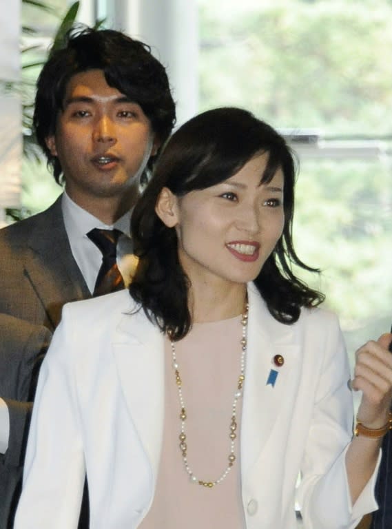 Japan's Liberal Democratic Party lawmaker Kensuke Miyazaki and his wife Megumi Kaneko, a fellow LDP parliamentarian, at the prime minister's official residence in Tokyo on March 24, 2015