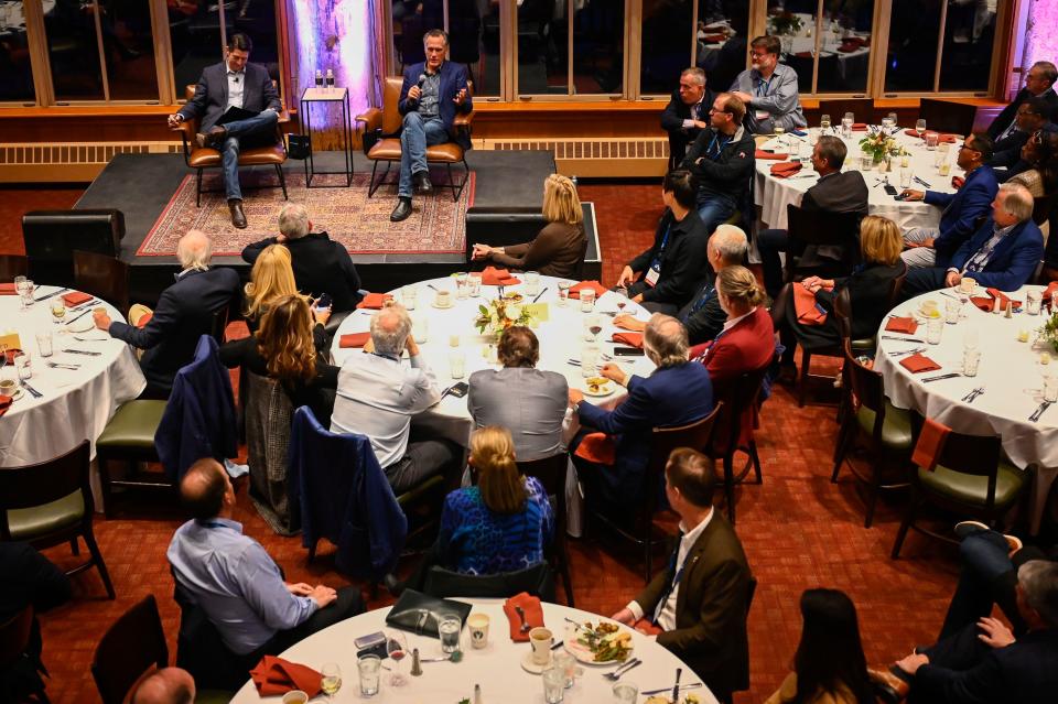 Former Speaker of the House Paul Ryan, R-Wis., top left, speaks with Sen. Mitt Romney, R-Utah, during the E2 Summit at Stein Eriksen Lodge on Tuesday, Oct. 10, 2023, in Park City. | Alex Goodlett, for the Deseret News