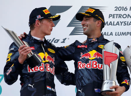 Formula One - F1 - Malaysia Grand Prix - Sepang, Malaysia- 2/10/16 Red Bull's Daniel Ricciardo of Australia celebrates with Red Bull's Max Verstappen of the Netherlands on the podium. REUTERS/Edgar Su