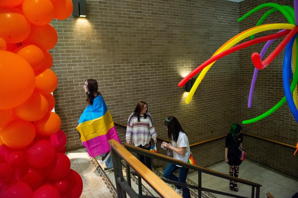 Attendees walk up the stairs and past rainbow balloons to the entrance of the Carl Perkins Civic Center during Jackson Pride Fest on Saturday, October 8, 2022, in Jackson, Tenn. 