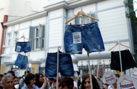 Women rights activists display shorts with slogans that read, "Don't Mess With My Outfit" during a protest against what they say are violence and animosity they face from men demanding they dress more conservatively, in Istanbul, Turkey, July 29, 2017. REUTERS/Murad Sezer