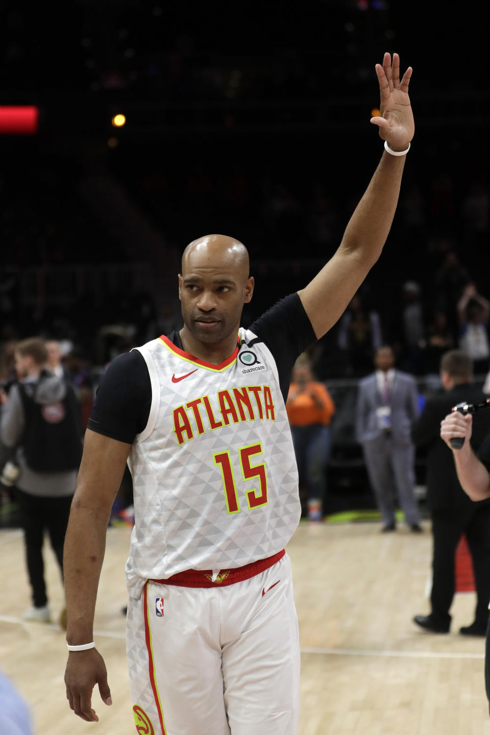 Atlanta Hawks guard Vince Carter (15) wavs to the crowd as he leaves the court following an NBA basketball game against the New York Knicks Wednesday, March 11, 2020, in Atlanta. (AP Photo/John Bazemore)
