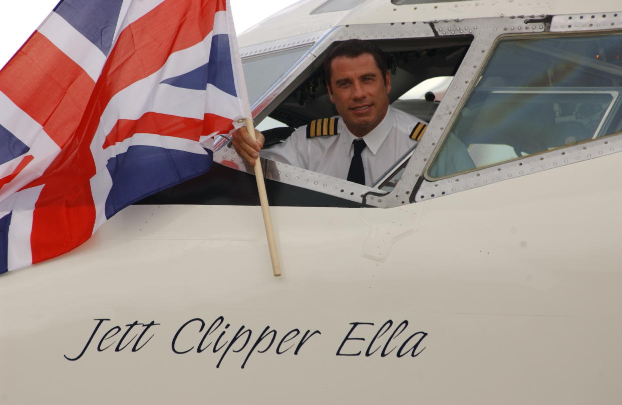 As part of his Spirit of Friendship Tour, John Travolta flies his own former Qantas Boeing 707 to Heathrow airpor having recently completed his 747-400 simulator training in Seattle. The Friendship Tour is set to go to Rome, Paris, Frankfurt and New York before returning to Los Angeles. (Photo by rune hellestad/Corbis via Getty Images)