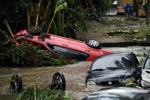 View of cars stuck in the water and mud, after heavy rains during the weekend in Realengo neighbourhood, in the suburbs of Rio de Janeiro, Brazil, on March 2, 2020