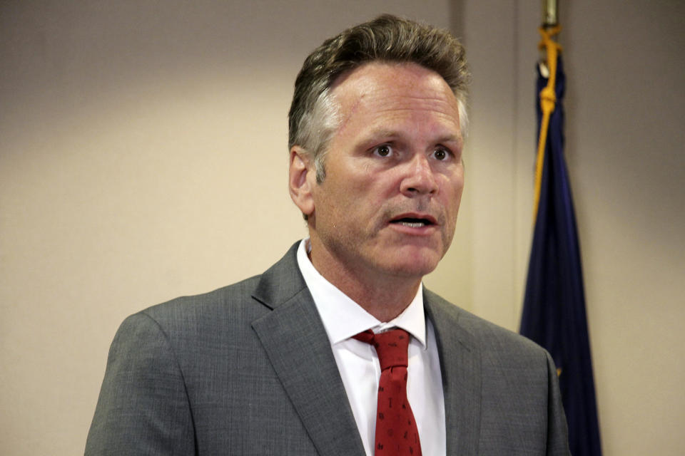 FILE - In this Aug. 13, 2019 file photo, Alaska Gov. Mike Dunleavy speaks at a news conference in Anchorage, Alaska. Dunleavy said he hopes to move past the rancor of his first year in office, amid an unsettled dispute with lawmakers over state spending and threat of a recall effort looming large. The Republican will mark a full year in office Tuesday, Dec. 3. (AP Photo/Mark Thiessen, File)