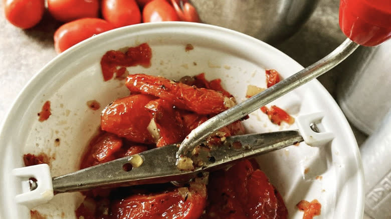 food mill grinding tomatoes