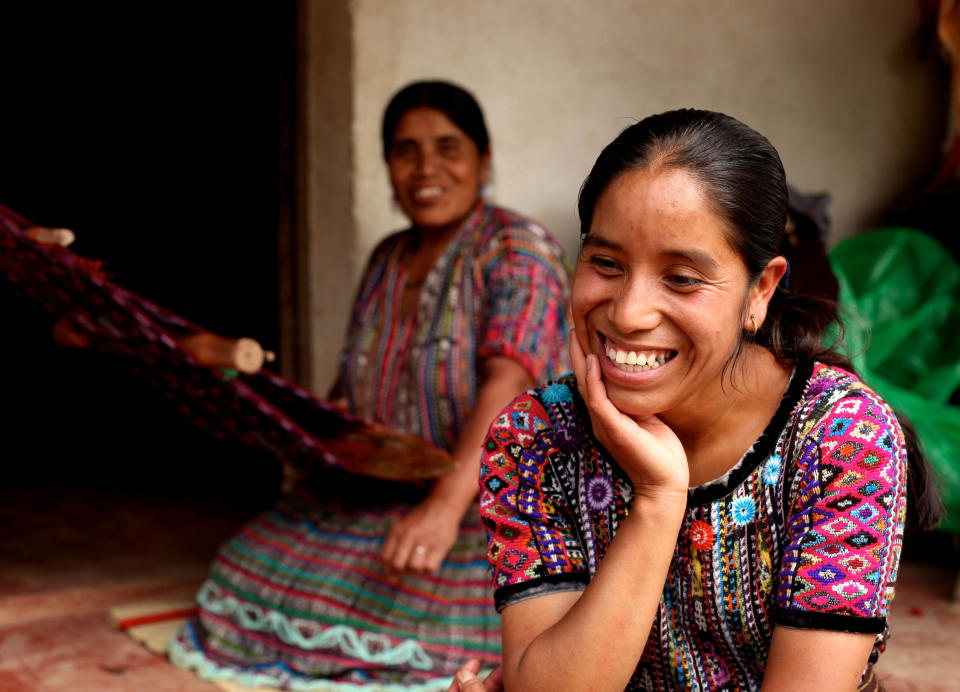 This 2010 photo provided by Living on One shows Rosa Coj Bocel, right, who got a microloan to start a weaving business, with her mother in Pena Blanca, Guatemala. Four U.S. college students spent a summer living in Pena Blanca on $1 a day per person to learn about issues related to rural poverty, then made a film about their experiences. (AP Photo/Living on One)