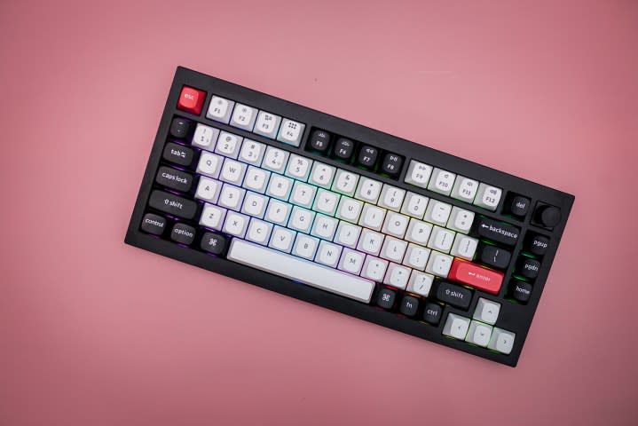 The Keychron Q1 HE sitting on a pink background.