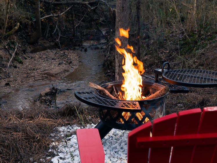 The tiny home is located right next to a small creek.